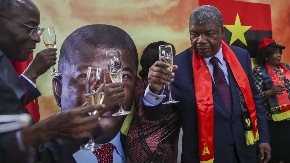 Presidential candidate of People's Movement for the Liberation of Angola - Labour Party (MPLA) Joao Lourenco (2-R) cheers during a press conference to react to the final election results presented by the National Election Commission (CNE), at MPLA headquarters in Luanda, Angola, 29 August 2022. PAULO NOVAIS/LUSA