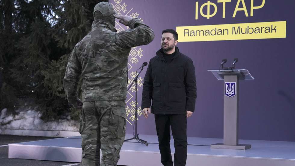 epa12790656 Ukrainian President Volodymyr Zelensky (R) before an Iftar dinner during the holy month of Ramadan in Kyiv, Ukraine, 02 March 2026, amid the Russian invasion. President Zelensky, along with other top Ukrainian officials, joined Muslim servicemen for the traditional fast-breaking meal to honor those defending the country. Iftar is the evening meal eaten by Muslims to break their daily fast after sunset during Ramadan, which in 2026 began in mid-February.  EPA/ANDREW KRAVCHENKO
