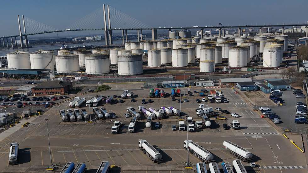 epa12833470 An image made with a drone shows tanker trucks  at the Navigator Terminal in Grays, Britain 19 March 2026. Global gas and oil prices have risen following attacks by Israel and Iran on refinaries in the Middle East as the conflict continues. European leaders have announced they were ready to join “appropriate efforts” to reopen the Strait of Hormuz, where Iran has attacked ships to effectively close the shipping route.  EPA/NEIL HALL
