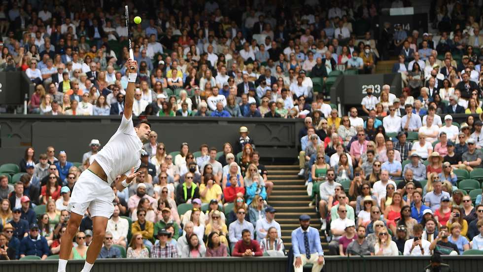 epa09324014 Novak Djokovic of Serbia in action during his round of 16 match against Cristian Garin of Chile at the Wimbledon Championships, Wimbledon, Britain 05 July 2021.  EPA/NEIL HALL EDITORIAL USE ONLY  EDITORIAL USE ONLY  EDITORIAL USE ONLY