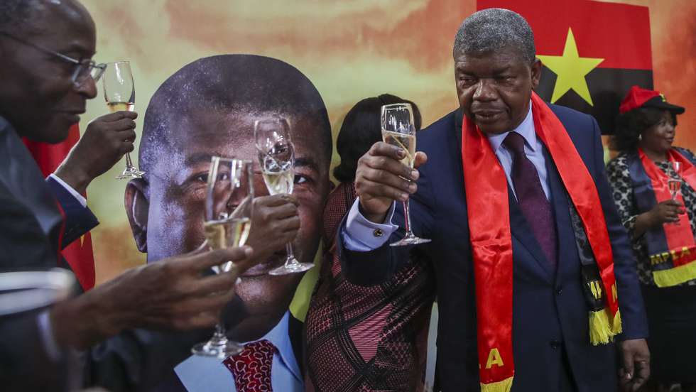 Presidential candidate of People's Movement for the Liberation of Angola - Labour Party (MPLA) Joao Lourenco (2-R) cheers during a press conference to react to the final election results presented by the National Election Commission (CNE), at MPLA headquarters in Luanda, Angola, 29 August 2022. PAULO NOVAIS/LUSA