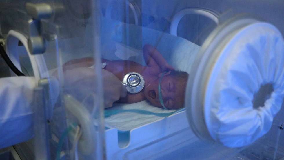 epa09029441 A newborn baby is kept in a nursery at the Rezaei Maternity hospital in Herat, Afghanistan, 22 February 2021. Rezaei hospital is funded by the overseas Afghan community from Germany as well as UNICEF. The hospital is dedicated to obstetrics, employing 80 doctors, 45 nannies and 8 nurses. Around 80 women give birth daily at the hospital. This hospital is equipped with advanced facilities.  EPA/JALIL REZAYEE