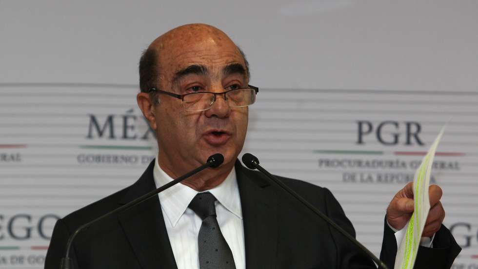 epa04519375 Mexican attorney general Jesus Murillo Karam attends a press conference in Mexico City, Mexico, 07 December 2014. Murillo Karam confirmed that the DNA of remains analized by the Austrian University of Innsbruck match that of Alexander Mora Venancio, one of the 43 missing students from Iguala. The 43 missing students had been officially listed as missing. Corrupt police abducted them and handed them over to the 'Guerreros Unidos' criminal gang to be killed. Gang members in custody later confessed to killing the students and burning their bodies. The murderous acts have thrown the government of Enrique Pena Nieto into a severe crisis.  EPA/Alex Cruz