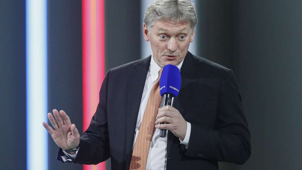 epa09654873 Kremlin spokesman Dmitry Peskov attends Russian President Vladimir Putin's annual life-broadcast news conference with Russian and foreign media at the Moscow Manege in Moscow, Russia, 23 December 2021. The President's Big Press Conference is an annual event that has been held since 2001. This year, the number of journalists was limited to 507 due to coronavirus.  EPA/YURI KOCHETKOV