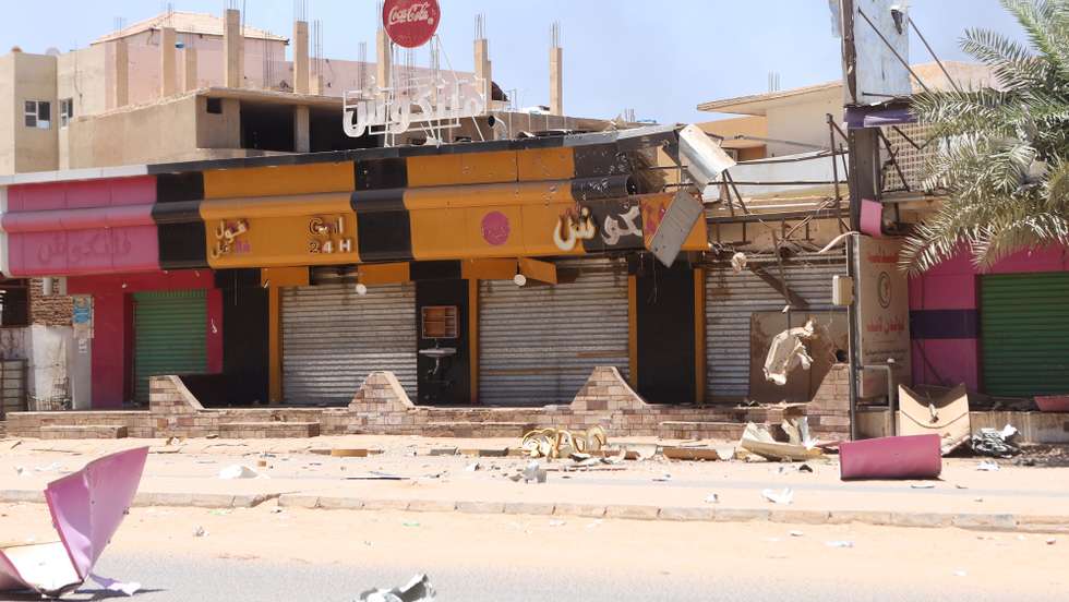 epa10579956 Damaged shops during the ongoing fighting between the Sudanese army and paramilitaries of the Rapid Support Forces (RSF) in Khartoum, Sudan, 19 April 2023. A power struggle erupted since 15 April between the Sudanese army led by army Chief General Abdel Fattah al-Burhan and the paramilitaries of the Rapid Support Forces (RSF) led by General Mohamed Hamdan Dagalo, resulting in at least 200 deaths according to doctors' association in Sudan.  EPA/STRINGER