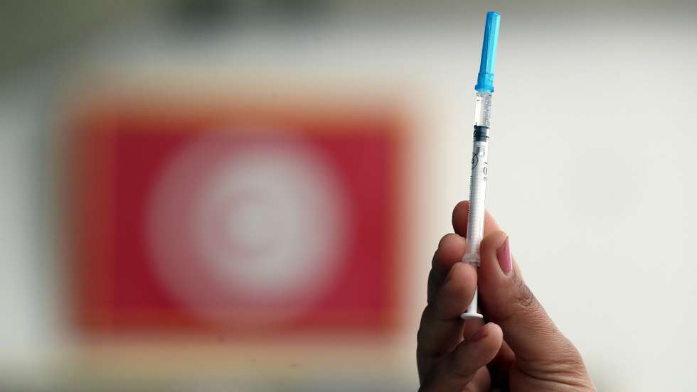 epa09071313 A Tunisian nurse shows a syringe with the Russian Sputnik V vaccine against COVID-19 at a hospital in Tunis, Tunisia, at the launch of a vaccination program, 13 March 2021. Tunisia has received 30,000 doses of Russia's COVID-19 vaccine, Sputnik V. Health workers are a priority for vaccination.  EPA/MOHAMED MESSARA