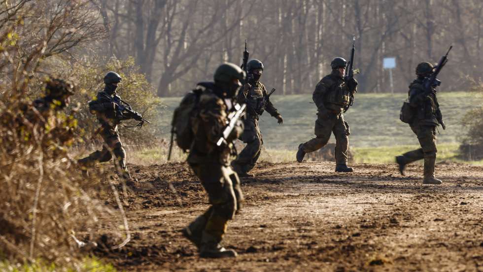 epa11228054 Soldiers take part in a military exercise of an armored infantry brigade of the German armed forces 'Bundeswehr', in Klietz, Germany, 18 March 2024. Over 90,000 troops from all 32 NATO Allies, including 12,000 from the Bundeswehr, will be deployed in the large-scale NATO maneuver 'Steadfast Defender 2024', taking place from January to May 2024. The German contribution to the NATO large-scale exercise is the 'Quadriga 2024', a series of large-scale combined exercises taking place in Germany and abroad over a period of five months.  EPA/HANNIBAL HANSCHKE