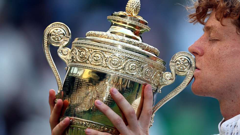 epaselect epa13107537 Jannik Sinner of Italy celebrates with the trophy after winning the Men's Singles final against Alexander Zverev of Germany at the Wimbledon Championships in London, Britain, 12 July 2026.  EPA/NEIL HALL