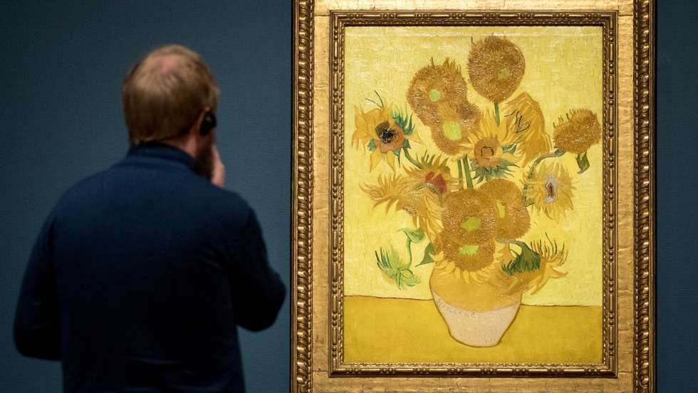 epa07395993 The painting 'Zonnebloemen' (Sunflowers) from 1889 by Dutch artist Vincent van Gogh is back at its place in the Van Gogh Museum in Amsterdam, The Netherlands, 25 February 2019, after extensive research and restoration works. The world-famous canvas will be at the heart of the exhibition Van Gogh and Sunflowers in summer 2019, in which the research and restoration will be explained in detail.  EPA/KOEN VAN WEEL