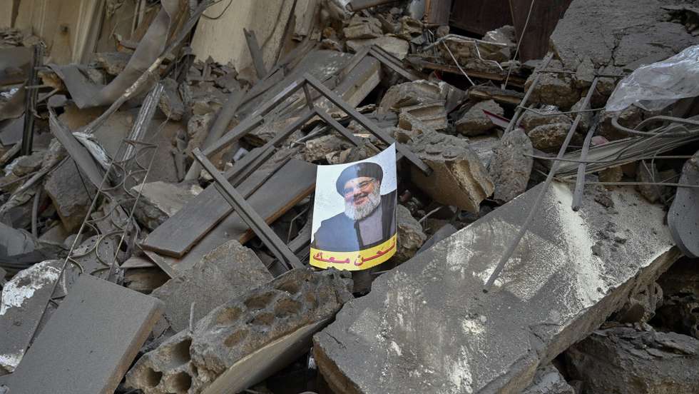 epaselect epa11641195 A picture of slain Hezbollah leader Hassan Nasrallah sits of over the rubble of a damaged building following an Israeli airstrike in Al Mreijeh, in the southern suburbs of Beirut, Lebanon, 04 October 2024. According to Lebanon's National News Agency (NNA), Israeli raids targeted Beirut's southern suburbs overnight, hitting areas near Mreijeh, Hadi Nasrallah Highway and Hadath, and resulting in the collapse of several buildings and facilities. Lebanese Minister of Health, Firas Abiad, announced on 03 October, that 1,974 people have been killed, including 127 children and 261 women, and 9,384 others have been injured in Lebanon since the beginning of the Hezbollah-Israeli conflict.  EPA/WAEL HAMZEH