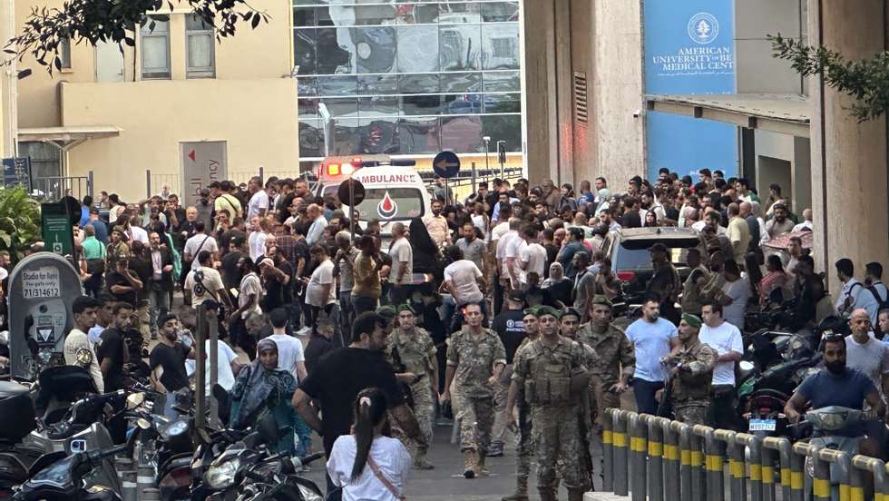 epa11609842 Lebanese soldiers and Hezbollah members gather outside a hospital where injured people were being transported, following an incident involving Hezbollah membersâ€™ wireless devices in Dahieh, Beirut, south Lebanon, 17 September 2024. According to Lebanonâ€™s state news agency, several â€˜wireless communication devices (pagers) were detonated using advanced technology.â€™ Several people with various injuries have been arriving at Lebanese hospitals, according to the Lebanese Public Health Emergency Operations Center of the Ministry of Public Health.  EPA/WAEL HAMZEH