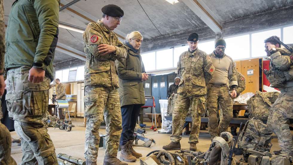 epa09719859 Minister of Defense Trine Bramsen (C) visits the Jutland Dragoon Regiment (Jydske Dragonregiment) in Holstebro, Denmark, 31 January 2022. In just over a month and a half, soldiers from the Jutland Dragoon Regiment in Holstebro will be sent to Estonia, where they will be part of NATO's increased presence in the Baltics.  EPA/Bo Amstrup