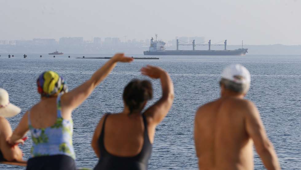 epaselect epa10106874 People watch cargo vessel Navi Star carrying 33,000 tonnes of corn to Ireland leave the port of Odesa, Ukraine, 05 August 2022. Two vessels left the port of Chornomorsk and one from the Odesa port. The bulk carriers NAVI STAR, ROJEN, and POLARNET with a total of 57,000 tonnes of corn on board are headed for Turkey, Great Britain, and Ireland as the Administration of Seaports of Ukraine reported. Ukraine started exporting grain since a safe passage deal was signed between Ukraine and Russia on 22 July in Istanbul. Russian troops on 24 February entered Ukrainian territory, starting a conflict that has provoked destruction and a humanitarian crisis.  EPA/STR