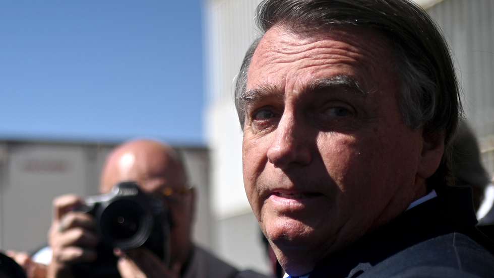 epa10704195 Former president of Brazil, Jair Bolsonaro, leaves the Federal Senate after visiting his son Senator Flavio Bolsonaro at the National Congress in Brasilia, Brazil 21 June 2023. The Superior Electoral Court (TSE) will begin a trial on 22 June for alleged abuses of power by former Brazilian President Jair Bolsonaro, who may lose all his political rights if found guilty.  EPA/Andre Borges