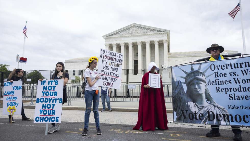 epa09940845 Protesters gather outside the Supreme Court as the Senate attempts to codify abortion protections in Washington, DC, USA, 11 May 2022. A historic leak of a US Supreme Court draft indicates that the Court will most likely overturn the 1973 Roe v. Wade decision that legalized abortion in the United States.  EPA/JIM LO SCALZO