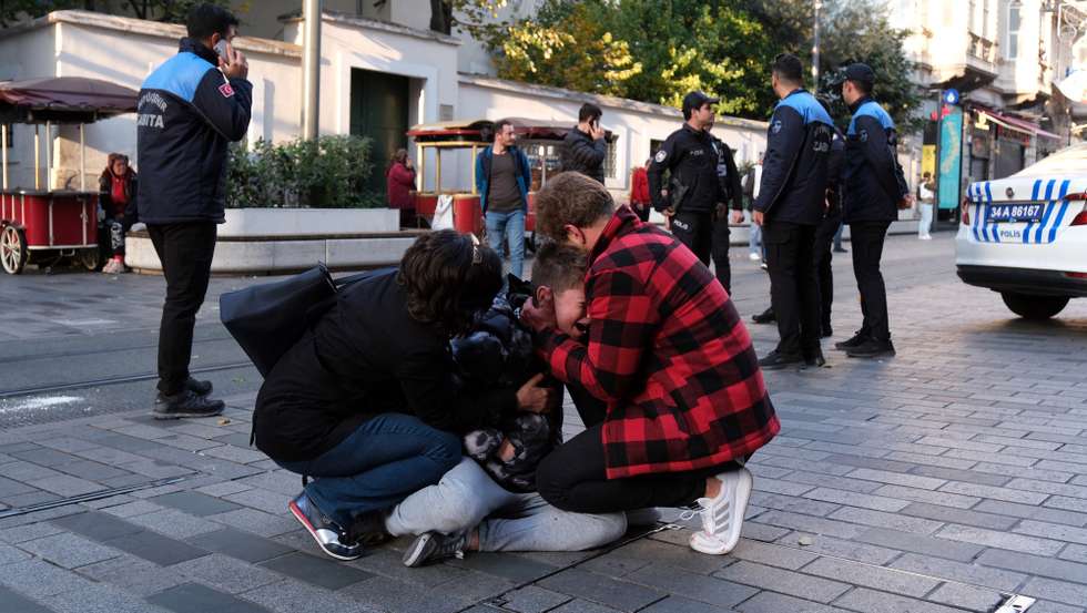 epa10303840 People react as Turkish policemen try to secure the area after an explosion at Istiklal Street in Istanbul, Turkey, 13 November 2022. According to governor Ali Yerlikaya, 6 people were killed and at least 53 people wounded in an explosion that occurred at roughly 4.20 p.m. local time. Emergency personnel were dispatched to the incident.  EPA/STR