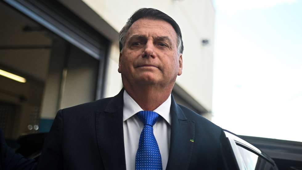 epa10742615 Former Brazilian President Jair Bolsonaro reacts after leaving the headquarter of the Federal Police in Brasilia, Brazil, 12 July 2023. Bolsonaro presented his testimony in a case of alleged coup denounced by Brazilian right-wing senator Marcos do Val.  EPA/Andre Borges