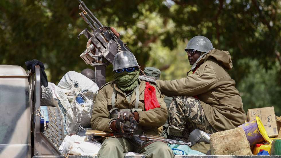 epa08610825 (FILE) - Malian soldiers patrol in the recently liberated town of Diabaly, Mali, 22 January 2013 (reissued 18 August 2020). Reports on 18 August 2020 state that gunfire was heard at Malian army base Kati outside Bamako. Foreign embassies such as Norway's and France's have called on their citizens in Mali to stay home amid what could possibly be a coup.  EPA/NIC BOTHMA *** Local Caption *** 50677002