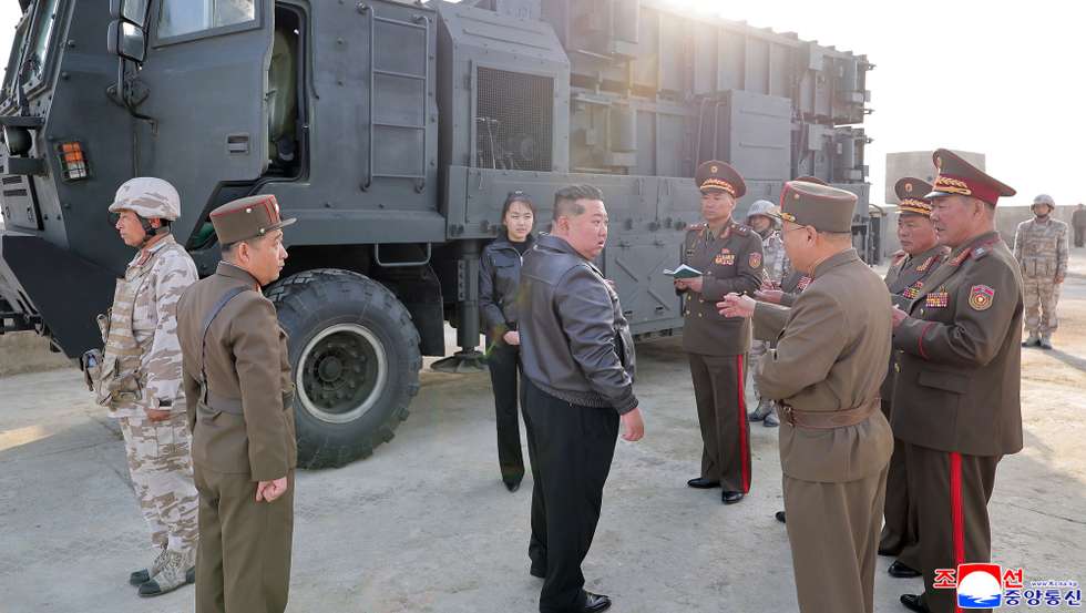 epa12901466 A photo released by the official North Korean Central News Agency (KCNA) shows North Korean leader Kim Jong Un (Centre front) and his daughter, Kim Ju Ae (Centre back), attending the test-fire of an improved Hwasongpho-11 Ra surface-to-surface tactical ballistic missile at an undisclosed location in North Korea, 19 April 2026 (issued 20 April 2026). According to KCNA, five missiles were launched toward an island target roughly 136 km away to verify the characteristics and efficacy of cluster and fragmentation mine warheads integrated into the tactical system.  EPA/KCNA  EDITORIAL USE ONLY