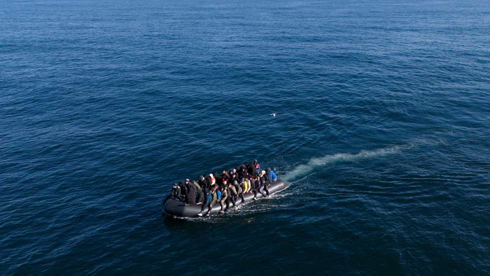 epaselect epa11201987 A picture taken with a drone shows migrants crossing the English Channel on a small boat, on 06 March 2024. The UK government has suffered more setbacks at the House of Lords recently on its plan to send migrants to Rwanda to deter the Channel crossings. Despite the British and French government&#039;s efforts to prevent migrants from making the dangerous journey on small boats, many are willing to take the risk to claim asylum in the UK.  EPA/TOLGA AKMEN