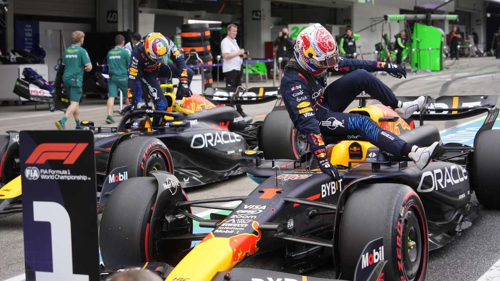 epa11262006 Red Bull Racing driver Max Verstappen (R) of Netherlands and his teammate Sergio Perez (L) jump out of their cars aftr the Qualifying for the Formula 1 Japanese Grand Prix at the Suzuka International Racing Course in Suzuka, Japan, 06 April 2024. Verstappen took the pole position and Perez clocked second fastest time for the Formula 1 Japanese Grand Prix held on 07 April 2024.  EPA/FRANCK ROBICHON