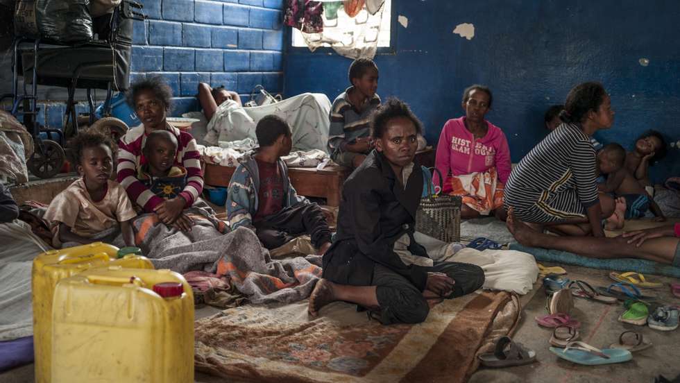 epaselect epa09730248 Some inhabitants of the neighborhood of Analamahitsy, whose houses were in danger of collapsing, are moved to a public elementary school as cyclone Batsirai is expected to hit Madagascar, in Antananarivo, Madagascar, 05 February 2022. According to a statement by the World Meteorological Organization (WMO), Madagascar is bracing for tropical cyclone Batsirai, which may intensify before landfall to Category 4 strength, with sustained winds of nearly 200 km/h. The cyclone is expected to make landfall in Eastern Madagascar on 05 February in the region of Mahanoro.  EPA/HENITSOA RAFALIA