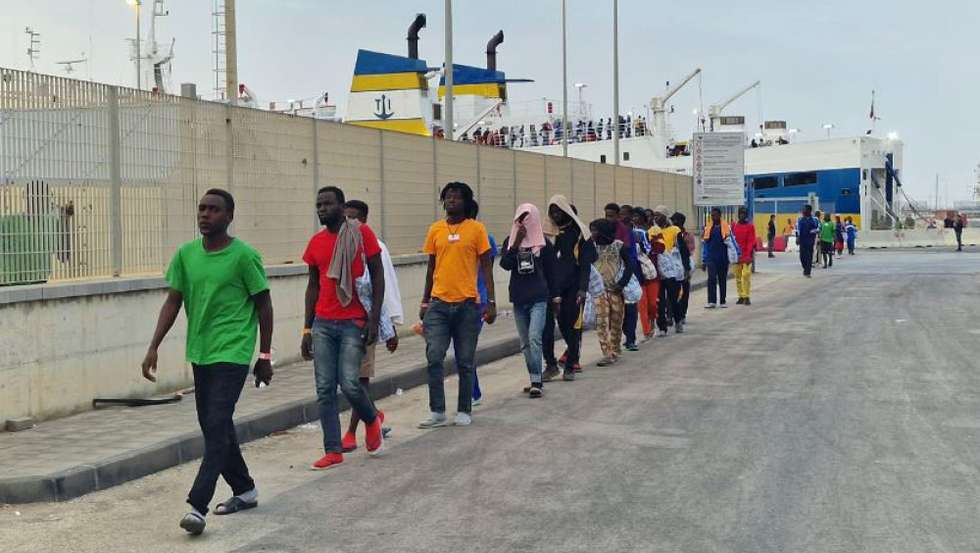 epa10868883 Migrants transferred from Lampedusa with the ferry line Cossyra, arrive in Porto Empedocle, near Agrigento, Sicily, Italy, 19 September 2023. About 200 migrants were transferred from Lapedusa Island to Sicilian hotspot for migrants in Porto Empedocle, controlled by the police. Italian authorities resumed transfers of migrants from Lampedusa after overcrowding issues at the tent camp set up at the Porto Empedocle on Sicily Island was resolved.  EPA/CONCETTA RIZZO BEST QUALITY AVAILABLE