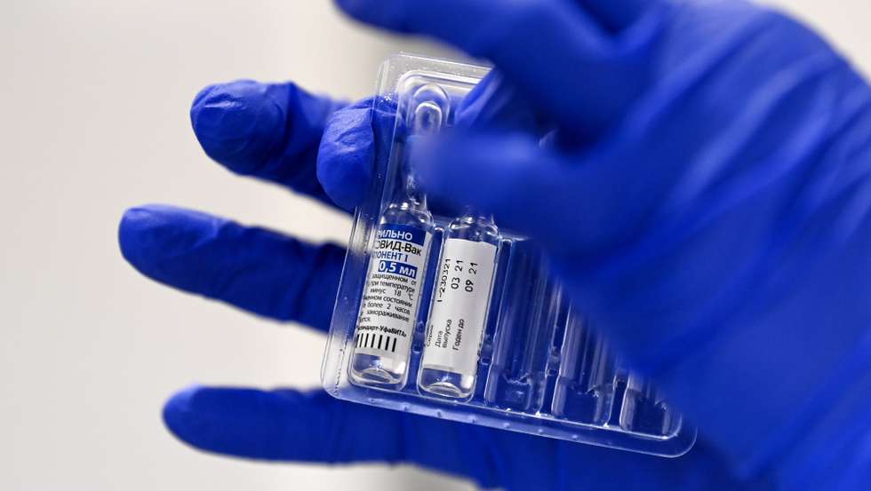 epa09120595 (FILE) - A nurse takes out vials of the Russian Sputnik V vaccine against Covid-19 during the vaccination at the Arena 'Boris Trajkovski' in Skopje, North Macedonia, 05 April 2021 (reissued 07 April 2021). The prime minister of the German federal state Bavaria Soeder on 07 April 2021 said the state had signed a preliminary contract over a purchase of Russian COVID-19 vaccine Sputnik V. An approval for the vaccine by the European Medicines Agency (EMA) is pending.  EPA/GEORGI LICOVSKI *** Local Caption *** 56807518