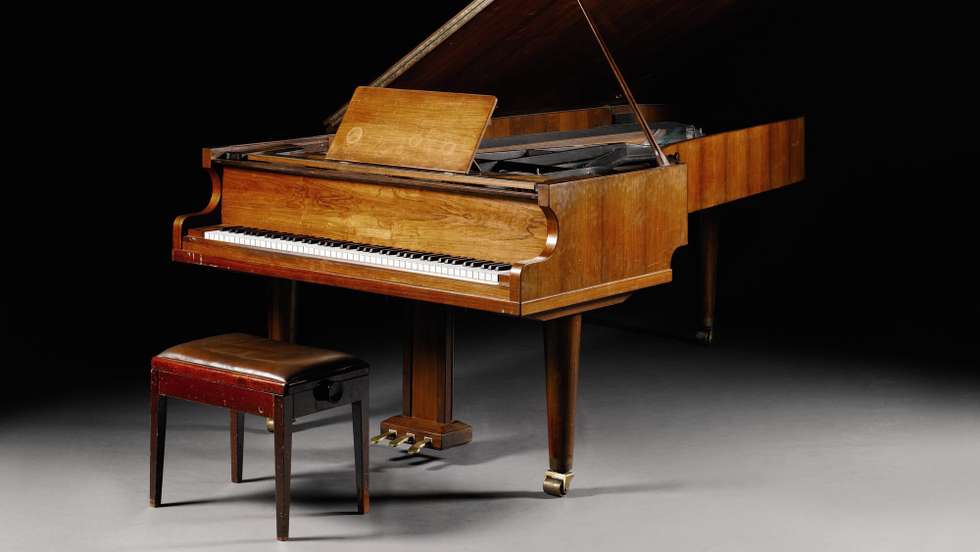 epa04900036 An undated handout image provided by Sotheby's on 27 August 2015 shows the 'ABBA Piano'. The instrument, on which the Swedish pop group recorded some of their songs, will be offered at the auction house's Rock and Pop sale in London on 29 September. It is estimated at 600,000-800,000 pound (820,000-1 million euro).  EPA/SOTHEBYS / HANDOUT  HANDOUT EDITORIAL USE ONLY/NO SALES