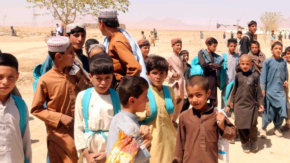 epa09426647 Afghan children leave the school after a class in Zabul, Afghanistan, 23 August 2021.  An estimated one million kids in Afghanistan face death due to 'severe acute malnutrition' this year, UNICEF warned on 23 August. In addition, '4.2 million children are out of school, including more than 2.2 million girls', reports said.  EPA/AKHTER GULFAM