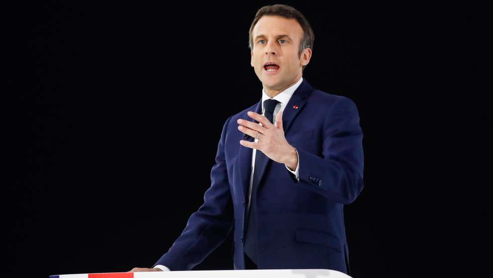 epa09866242 French President and liberal party La Republique en Marche (LREM) candidate for re-election Emmanuel Macron delivers a speech during his first campaign meeting at the Paris La Defense Arena in Nanterre, near Paris, France, 02 April 2022. The first round of the French presidential election will take place on 10 April 2022 and the second round on 24 April 2022.  EPA/Mohammed Badra
