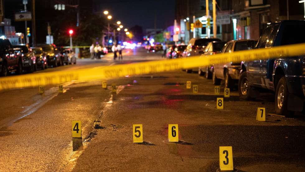 epa10725049 Police officials work at the scene of a mass shooting in the Kingsessing section of South Philadelphia, Pennsylvania, USA, 03 July 2023. Four people were killed and two others injured by a suspect who police placed into custody after capturing him wearing a bulletproof vest and carrying multiple weapons, according to the Philadelphia Police Department.  EPA/TRACIE VAN AUKEN