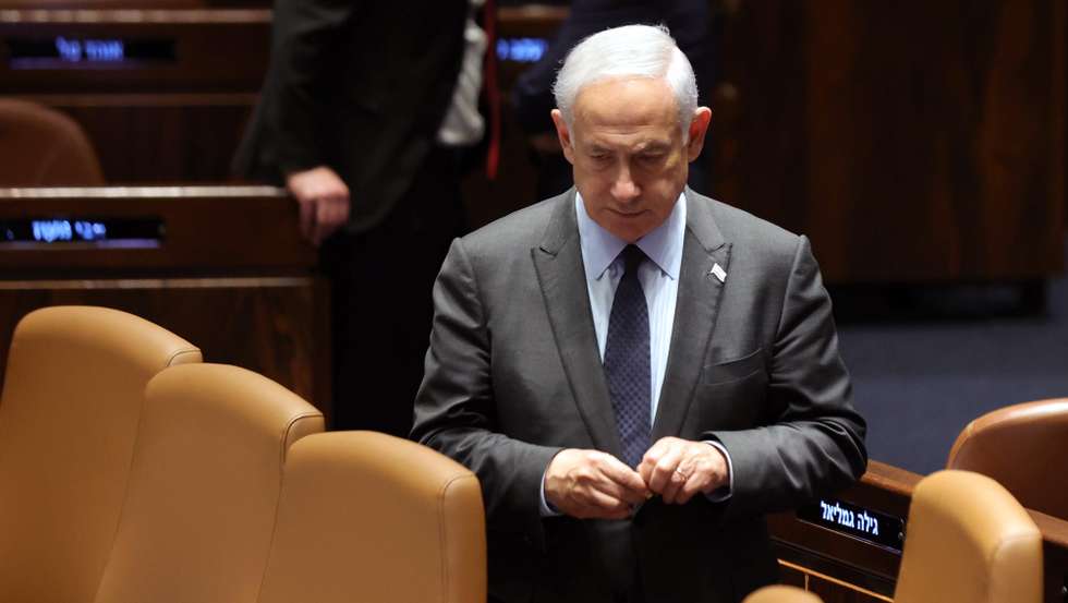 epa10545565 Israeli Prime Minister Benjamin Netanyahu attends a voting session in the Knesset, the Israeli parliament, in Jerusalem, Israel, 27 March 2023. Mass protests have been held in Israel for 12 weeks against the government's plans to reform the justice system and limit the power of the Israeli Supreme Court.  EPA/ABIR SULTAN