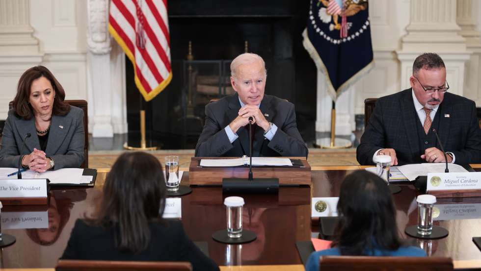 epa10223778 US Vice President Kamala Harris (L) and Secretary of the Department of Education Miguel Cardona (R) listen as US President Joe Biden speaks during a meeting of the Task Force on Reproductive Healthcare Access in the the State Dining Room of the White House, Washington, DC, USA, 04 October 2022.  EPA/Oliver Contreras / POOL