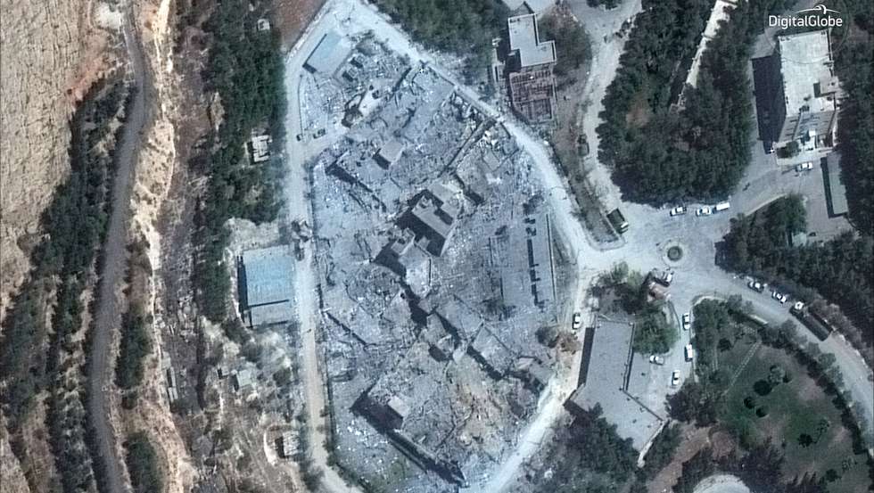 epa06672550 A handout satellite photo made available by 15 April 2018 by DigitalGlobe, showing the Barzah Research and Development Center in Damascus, Syria, after the attack by coalition forces missiles and rockets early 14 April 2018. US, France, and Britain launched strikes against Syria on 14 April 2018 in response to Syria's suspected chemical weapons attack.  EPA/DIGITALGLOBE HANDOUT (Satellite image © 2018 DigitalGlobe, a Maxar company.) HANDOUT EDITORIAL USE ONLY/NO SALES