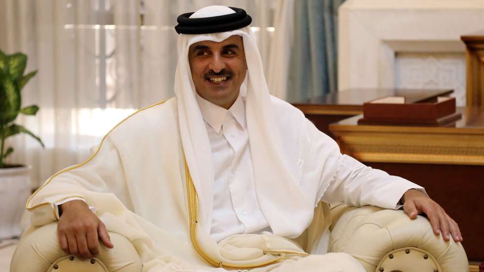epa09433709 Qatar's Emir Sheikh Tamim bin Hamad al-Thani looks on during a meeting with Iraqi president at the Iraqi presidential palace in Baghdad, Iraq, 28 August 2021. Bin Hamad al-Thani arrived in the Iraqi capital on an official visit to attend the Baghdad summit for Cooperation and Partnership.  EPA/AHMED JALIL