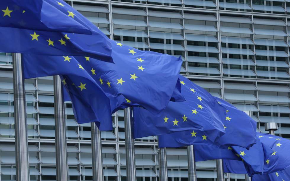 epa12276806 European Union flags at the European commission headquarters in Brussels, Belgium, 01 August 2025. U.S. President Donald Trump signed an executive order imposing tariffs of 15 percent on most EU goods and up to 41 percent to other countries. The tariffs take effect on 07 August 2025, a one-week delay to allow more time for negotiations.  EPA/OLIVIER HOSLET