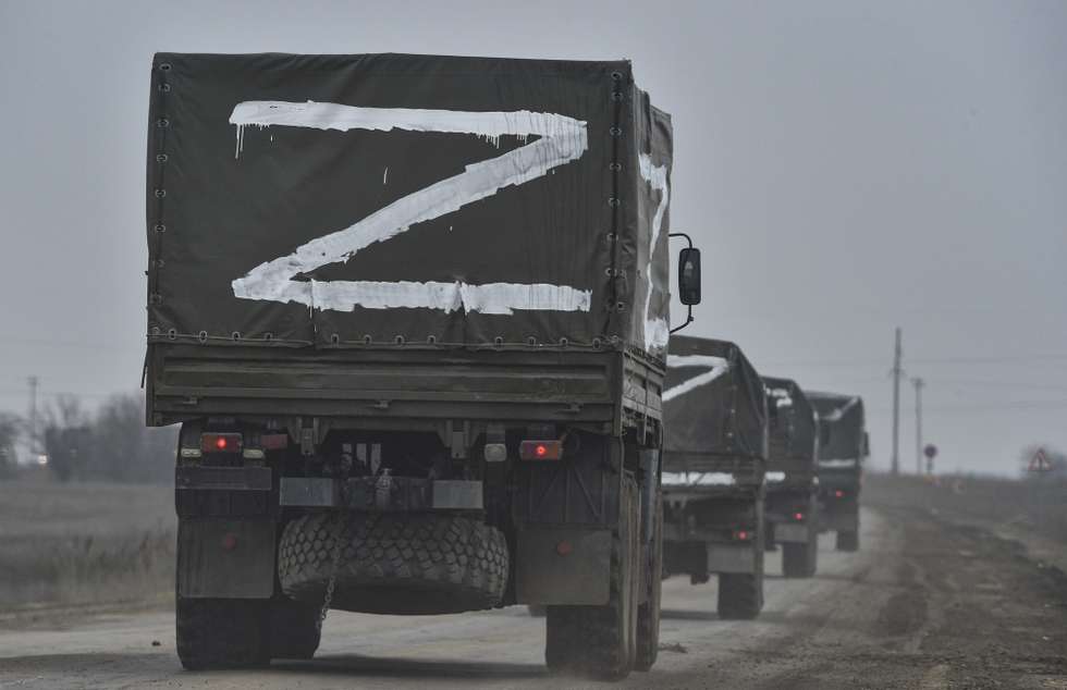 epa09840168 (FILE) - Russian troops move towards Ukraine on the road near Armiansk, Crimea, 25 February 2022 (reissued 21 March 2022). Russian troops entered Ukraine on 24 February prompting the country's president to declare martial law and triggering a series of announcements by Western countries to impose severe economic sanctions on Russia. More than three million Ukrainians became refugees, around 700 civilians were killed and over 1.000 more inured in the month-long conflict, the United Nations said.  EPA/STRINGER  ATTENTION: This Image is part of a PHOTO SET