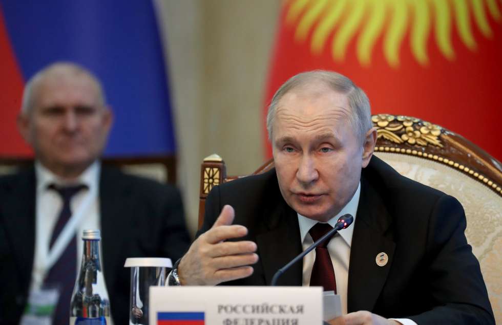epa10528645 (FILE) - Russian President Vladimir Putin gestures during a meeting of the Supreme Eurasian Economic Council in Bishkek, Kyrgyzstan, 09 December 2022 (reissued 17 March 2023). The International Criminal Court (ICC) in The Hague, the Netherlands, has issued an arrest warrant on 17 March 2023 for Russian President Vladimir Putin, accusing him of being responsible for war crimes, including the unlawful deportation and transfer of children from occupied areas of Ukraine to the Russian Federation. The alleged crimes were committed in Ukrainian occupied territory at least from 24 February 2022, when Russia launched its full-scale invasion, the court added. Maria Alekseyevna Lvova-Belova, Russia's commissioner for children's rights, is also wanted by the ICC.  EPA/IGOR KOVALENKO