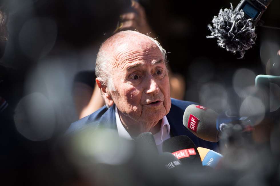 epaselect epa10058873 The former FIFA President, Joseph Blatter (C) surrounded by media representatives, speaks to the press in front of the Swiss Federal Criminal Court after the verdict has been announced, in Bellinzona, Switzerland, 08 July 2022. The trial ended with an acquittal. Former FIFA President Joseph Blatter and former UEFA president Michel Platini, stood trial before the Federal Criminal Court over a suspicious two-million payment. The Federal Prosecutor's Office accused them of fraud. The defense spoke of a conspiracy.  EPA/ALESSANDRO CRINARI