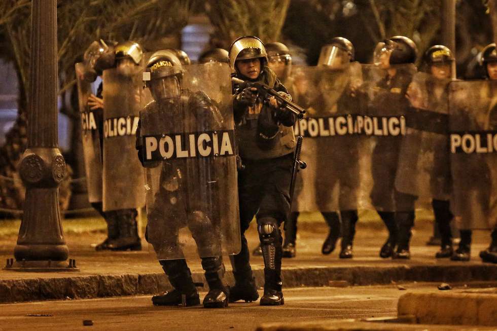 epa10432309 Police are seen during clashes with demonstrators during a new day of marches against the presidency of Dina Boluarte in Lima, Peru, 26 January 2023. Thousands of protesters from various regions of Peru traveled again this 26 January along the Pan-American Highway North of Lima, with the aim of reaching the historic center, to demand the resignation of Peruvian President Dina Boluarte.  EPA/Antonio Melgarejo