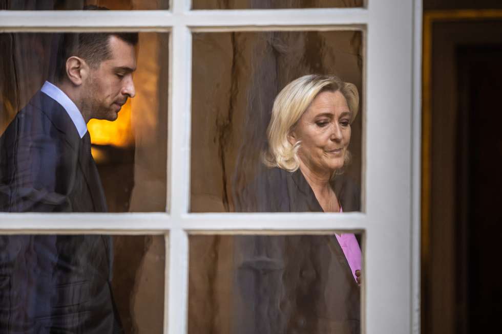 epaselect epa12064488 President of the far-right Rassemblement National (RN) parliamentary group, Marine Le Pen (R), and RN President Jordan Bardella (L) leave after a meeting with the French prime minister as part of the consultations on a reform of the electoral system and proportional voting, at Hotel Matignon in Paris, France, 30 April 2025.  EPA/CHRISTOPHE PETIT TESSON