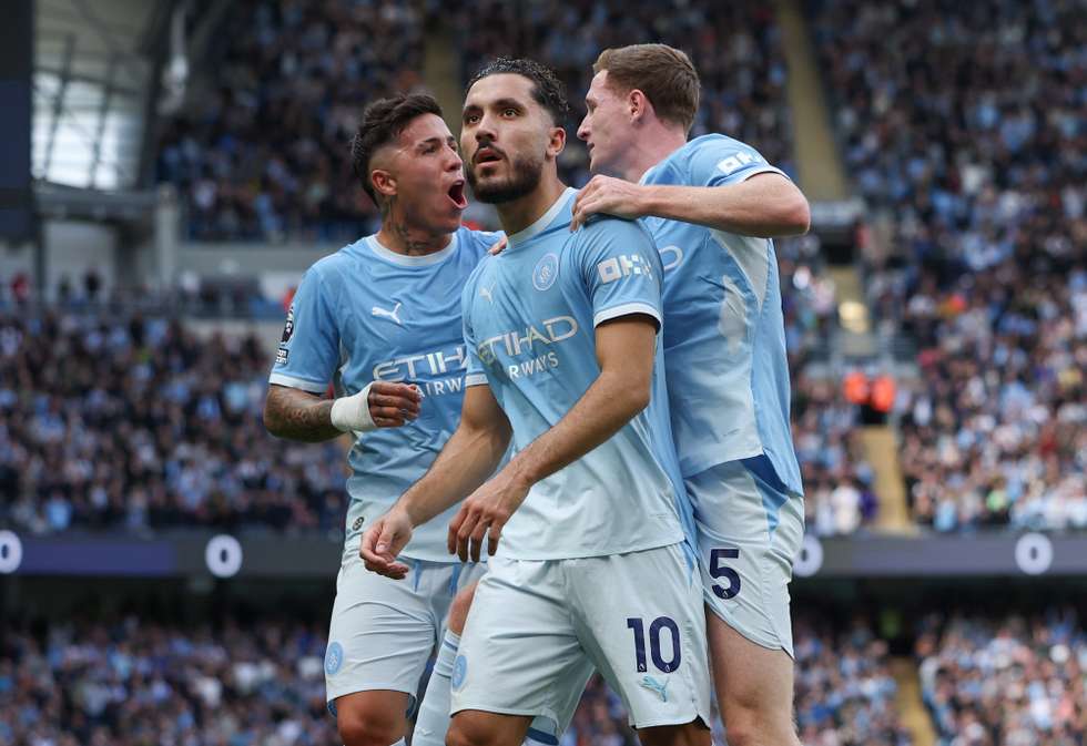 epa13252001 Rayan Cherki of Manchester City (C) celebrates scoring the 2-1 goal with Enzo Fernandez of Manchester City (L) and Elliot Anderson of Manchester City (R) during the English Premier League match between Manchester City and Sunderland AFC, Manchester, Britain, 20 September 2026.  EPA/ADAM VAUGHAN EDITORIAL USE ONLY. No use with unauthorized audio, video, data, fixture lists, club/league logos, 'live' services or NFTs. Online in-match use limited to 120 images, no video emulation. No use in betting, games or single club/league/player publications.