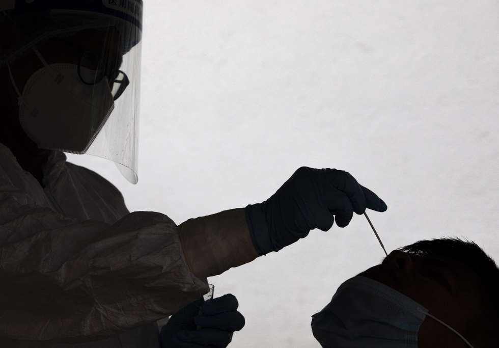 epa09393899 A health worker collects a nose swab sample for a PCR test amid the new mutant of the Delta Covid-19 variant at Sukraraj Tropical and Infectious Disease Hospital in Kathmandu, Nepal, 04 August 2021.  Kathmandu District Administration urged the residents of Kathmadu to avoid gatherings that may lead to overcrowding such as protests, rallies, conventions, meetings to prevent from the new mutant of the Delta COVID-19 variant.  EPA/NARENDRA SHRESTHA
