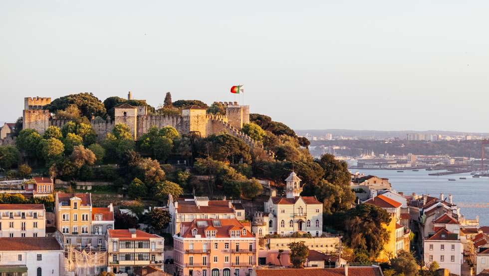 Lisbon cityscape with St. George Castle (Castelo de São Jorge) at sunset, Portugal