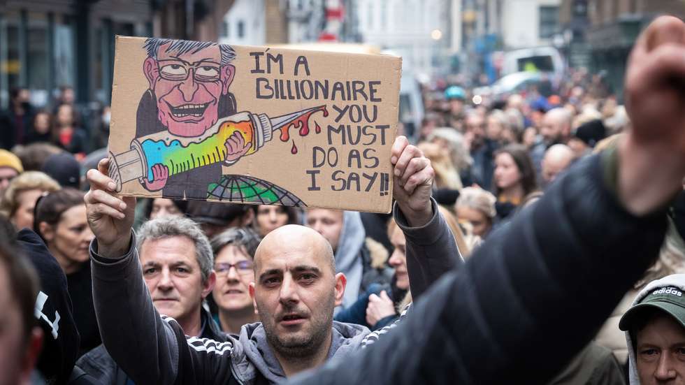 A protester holding a placard expressing his opinion as they