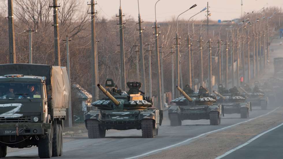 A column of tanks marked with the Z symbol stretches into