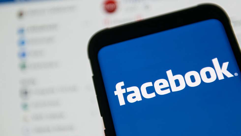 In this photo illustration a Facebook logo seen displayed on