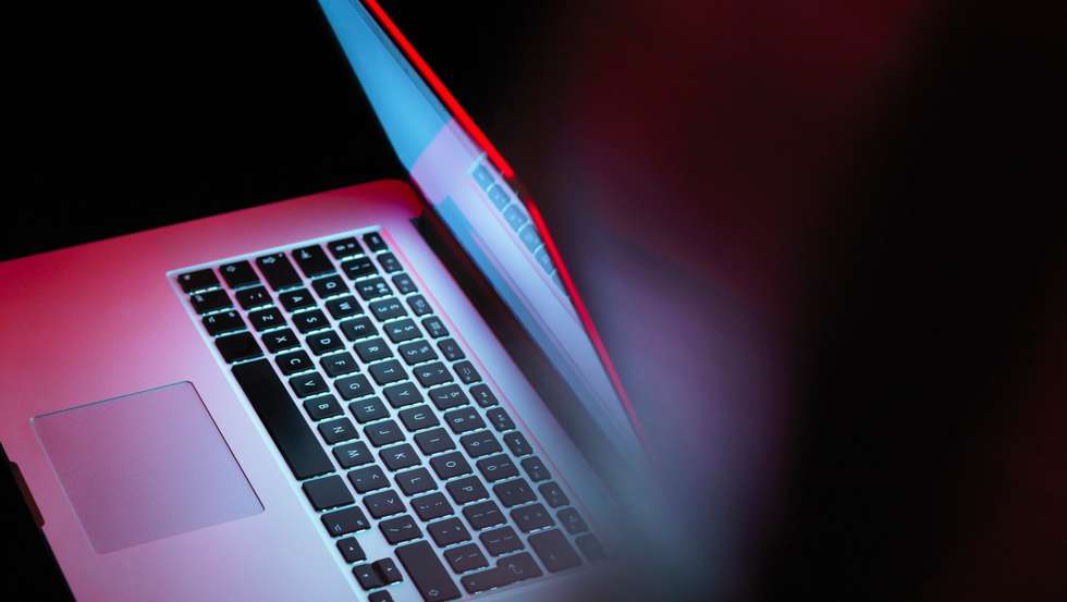 Cyber attack, laptop computer being infected by virus