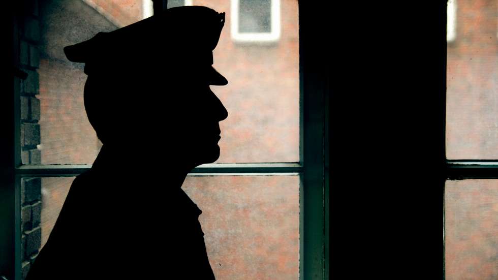 Silhouette of a prison/police warden